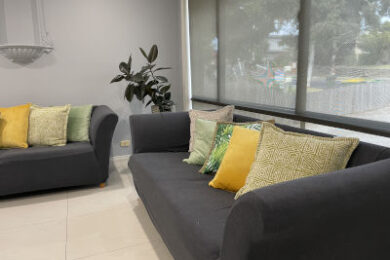 Couches in waiting room with colourful cushions
